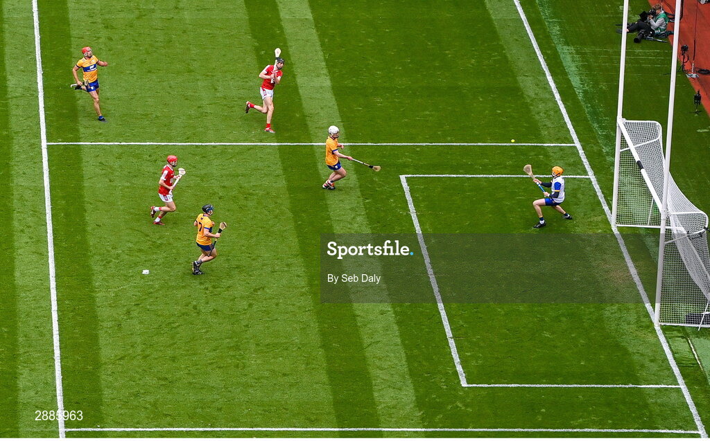 21 July 2024; Robert Downey of Cork, top, scores his side's first goal, past Clare goalkeeper Eibhear Quilligan, during the GAA Hurling All-Ireland Senior Championship Final match between Clare and Cork at Croke Park in Dublin. Photo by Seb Daly/Sportsfile