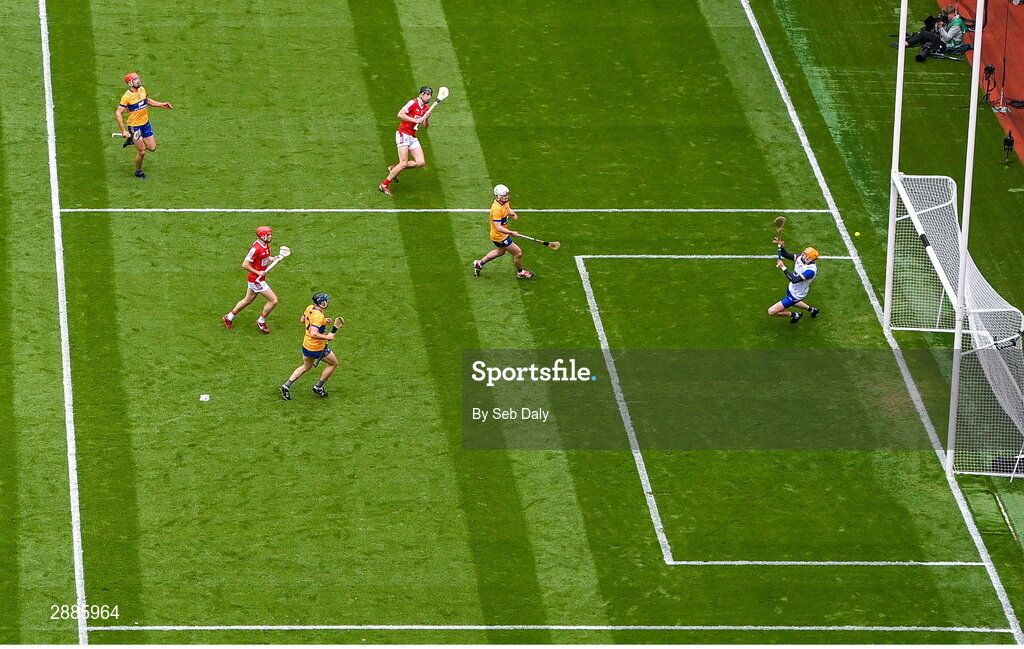 21 July 2024; Robert Downey of Cork, top, scores his side's first goal, past Clare goalkeeper Eibhear Quilligan, during the GAA Hurling All-Ireland Senior Championship Final match between Clare and Cork at Croke Park in Dublin. Photo by Seb Daly/Sportsfile