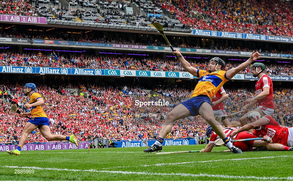 21 July 2024; Tony Kelly of Clare, right, collides with Cork goalkeeper Patrick Collins after scoring their side's third goal during the GAA Hurling All-Ireland Senior Championship Final match between Clare and Cork at Croke Park in Dublin. Photo by Seb Daly/Sportsfile