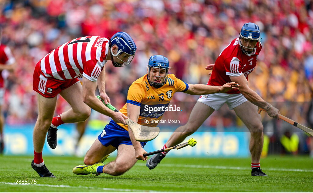 21 July 2024; Shane O'Donnell of Clare in action against Cork goalkeeper Patrick Collins and Seán O'Donoghue of Cork during the GAA Hurling All-Ireland Senior Championship Final between Clare and Cork at Croke Park in Dublin. Photo by Brendan Moran/Sportsfile