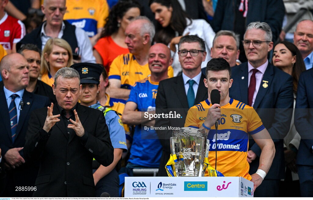 21 July 2024; Clare captain Tony Kelly makes his speech, which is signed by Senan Dunne, left, after the GAA Hurling All-Ireland Senior Championship Final between Clare and Cork at Croke Park in Dublin. Photo by Brendan Moran/Sportsfile