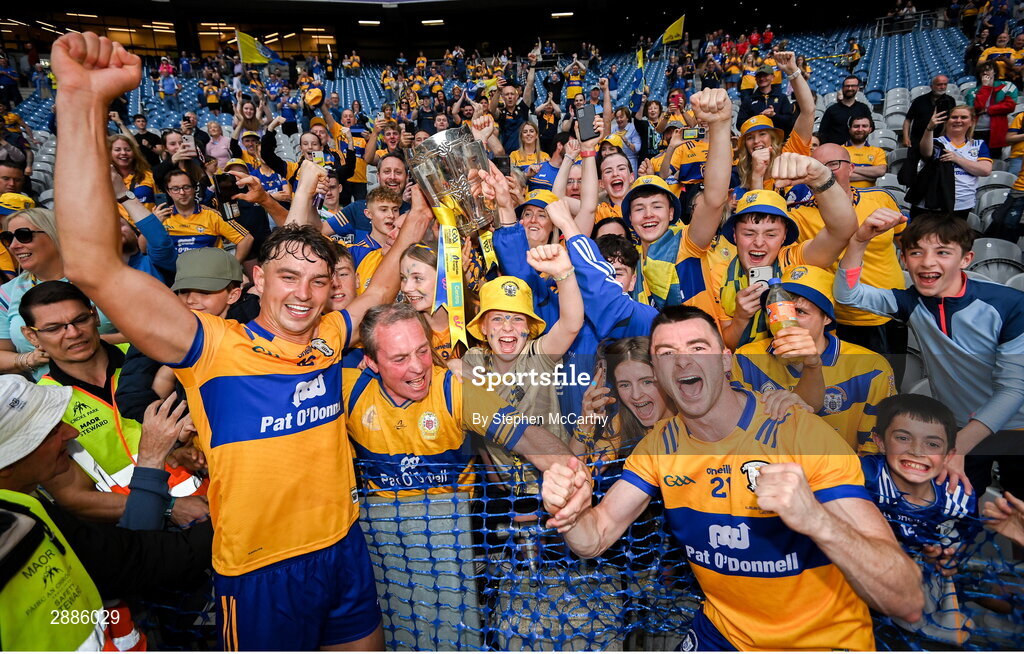 21 July 2024; Peter Duggan, left, Ryan Taylor, right, and Clare supporters celebrate with the Liam MacCarthy cup after the GAA Hurling All-Ireland Senior Championship Final between Clare and Cork at Croke Park in Dublin. Photo by Stephen McCarthy/Sportsfile