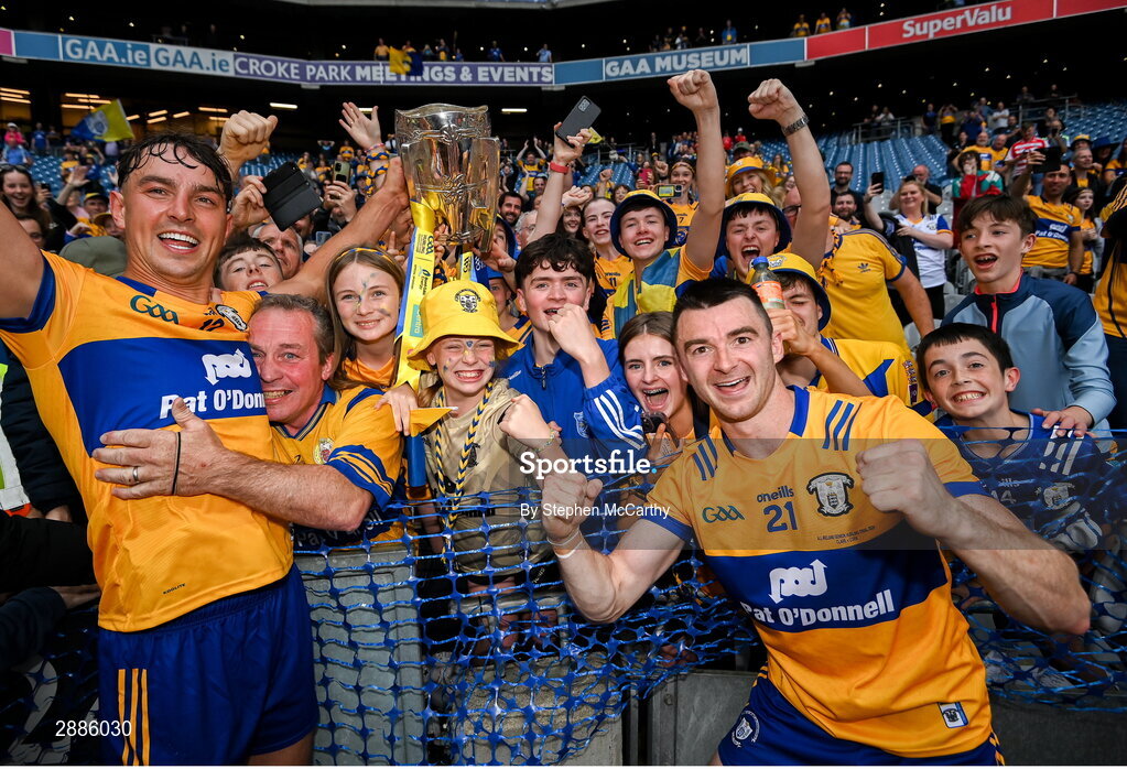 21 July 2024; Peter Duggan, left, Ryan Taylor, right, and Clare supporters celebrate with the Liam MacCarthy cup after the GAA Hurling All-Ireland Senior Championship Final between Clare and Cork at Croke Park in Dublin. Photo by Stephen McCarthy/Sportsfile