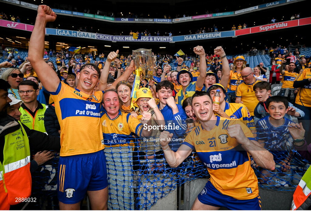 21 July 2024; Peter Duggan, left, Ryan Taylor, right, and Clare supporters celebrate with the Liam MacCarthy cup after the GAA Hurling All-Ireland Senior Championship Final between Clare and Cork at Croke Park in Dublin. Photo by Stephen McCarthy/Sportsfile