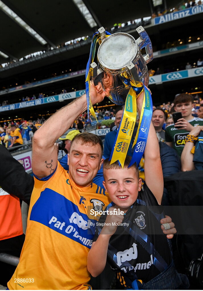 21 July 2024; Shane O'Donnell of Clare celebrates with the Liam MacCarthy cup and supporter David Moloney after the GAA Hurling All-Ireland Senior Championship Final between Clare and Cork at Croke Park in Dublin. Photo by Stephen McCarthy/Sportsfile
