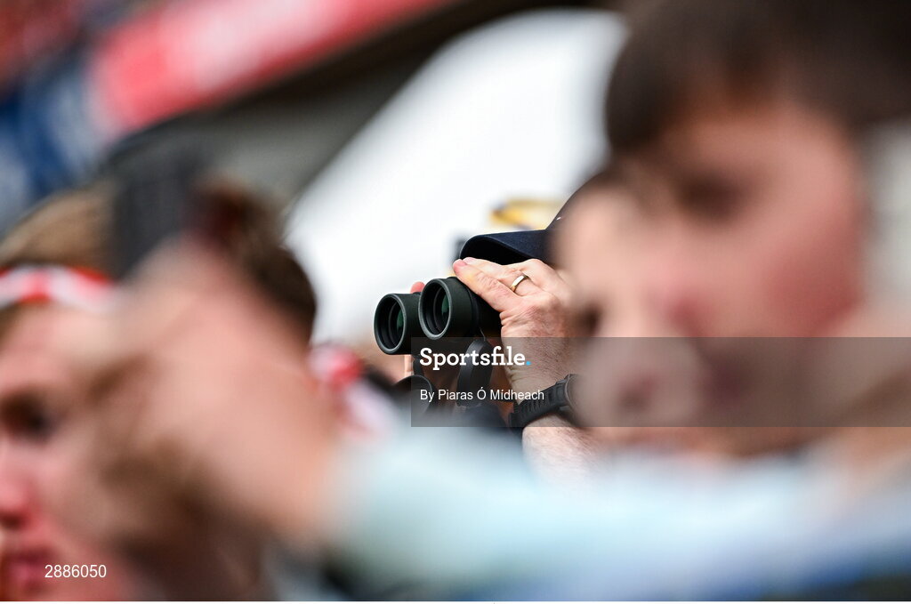 21 July 2024; A man watches the match through binoculars during the GAA Hurling All-Ireland Senior Championship Final between Clare and Cork at Croke Park in Dublin. Photo by Piaras Ó Mídheach/Sportsfile