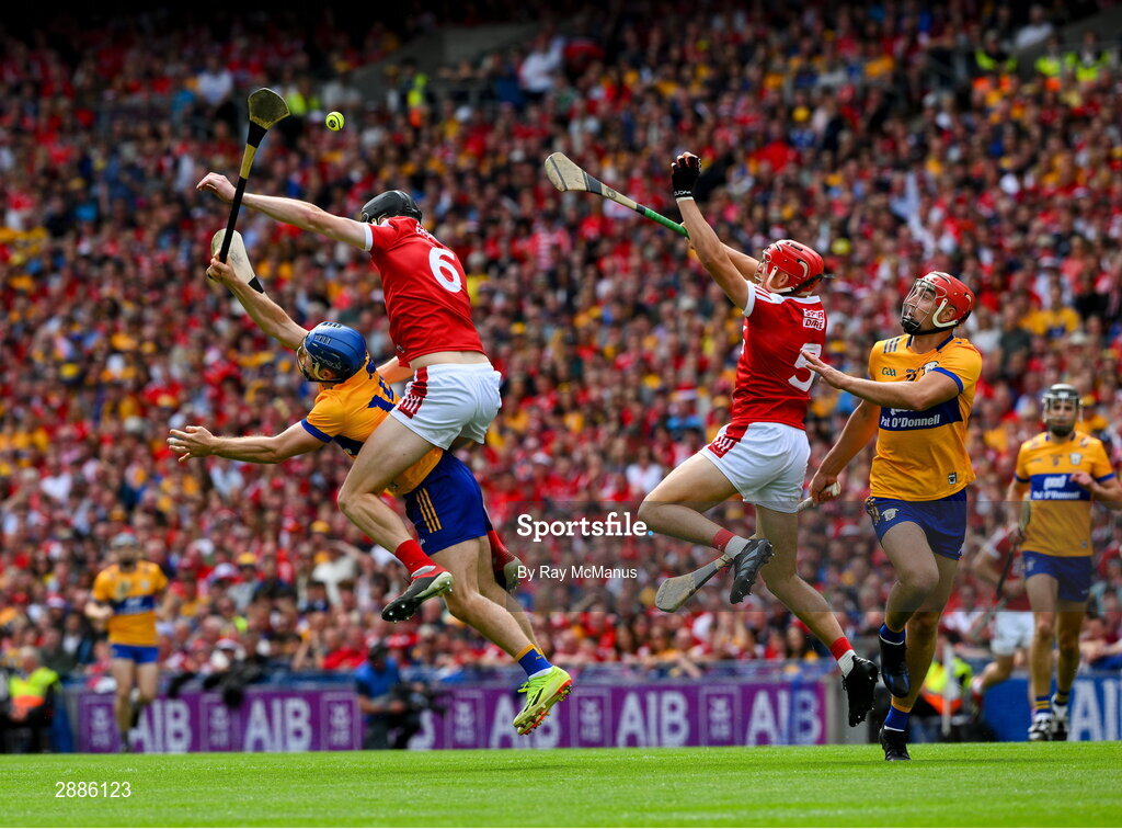 21 July 2024; Action features Shane O'Donnell of Clare who is tackled by Robert Doeney of Cork as Ciaran Joyce of Cork and Peter Duggan of Clare await developments during the GAA Hurling All-Ireland Senior Championship Final between Clare and Cork at Croke Park in Dublin. Photo by Ray McManus/Sportsfile