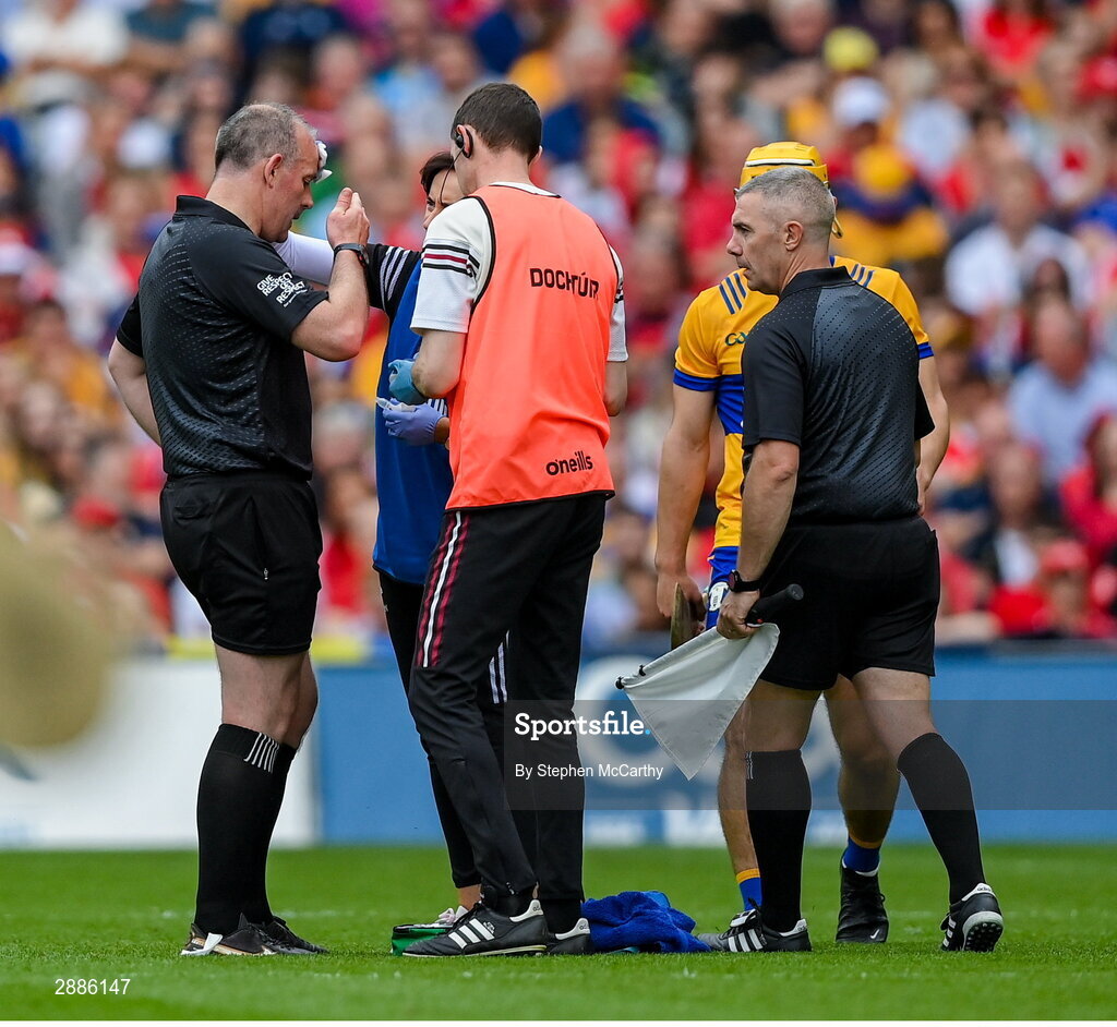 21 July 2024; Referee Johnny Murphy receives medical attention during the GAA Hurling All-Ireland Senior Championship Final between Clare and Cork at Croke Park in Dublin. Photo by Stephen McCarthy/Sportsfile