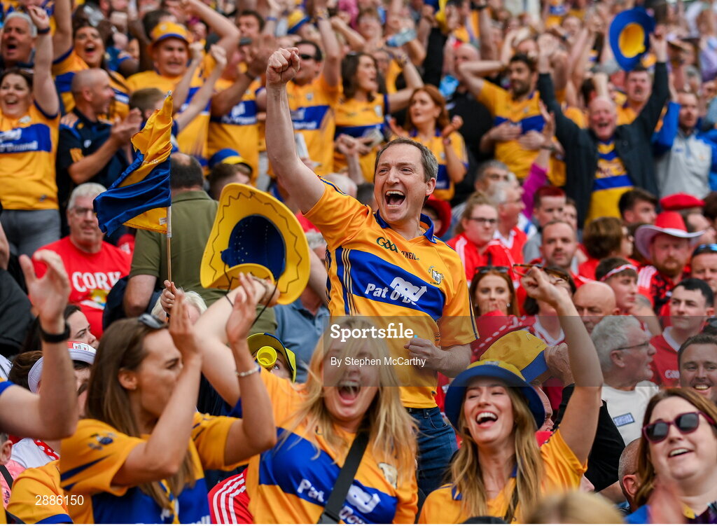 21 July 2024; Clare supporters celebrate near the end of the GAA Hurling All-Ireland Senior Championship Final between Clare and Cork at Croke Park in Dublin. Photo by Stephen McCarthy/Sportsfile