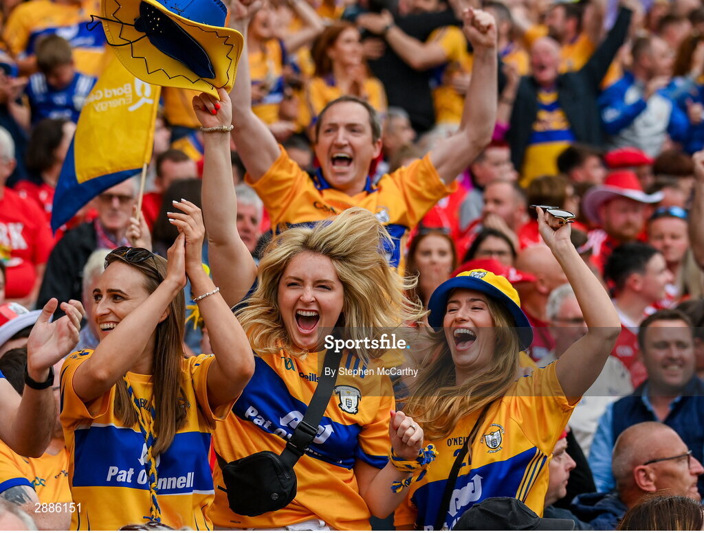 21 July 2024; Clare supporters celebrate near the end of the GAA Hurling All-Ireland Senior Championship Final between Clare and Cork at Croke Park in Dublin. Photo by Stephen McCarthy/Sportsfile