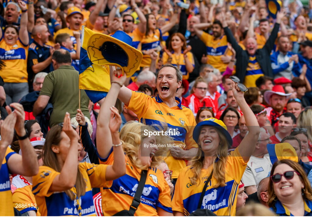 21 July 2024; Clare supporters celebrate near the end of the GAA Hurling All-Ireland Senior Championship Final between Clare and Cork at Croke Park in Dublin. Photo by Stephen McCarthy/Sportsfile