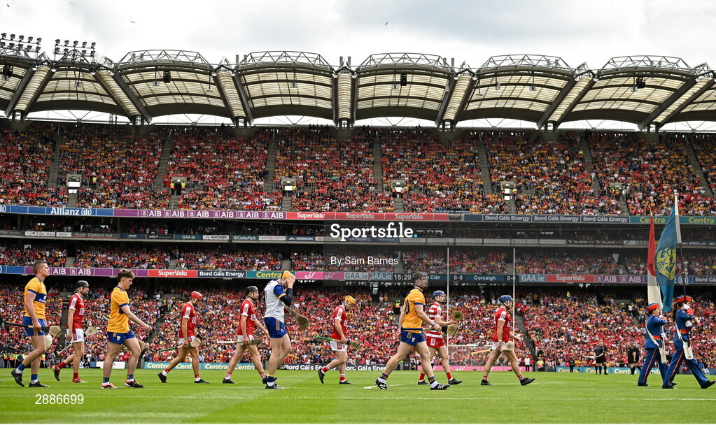 21 July 2024; Players from both sides march behind the Artane band before the GAA Hurling All-Ireland Senior Championship Final between Clare and Cork at Croke Park in Dublin. Photo by Sam Barnes/Sportsfile
