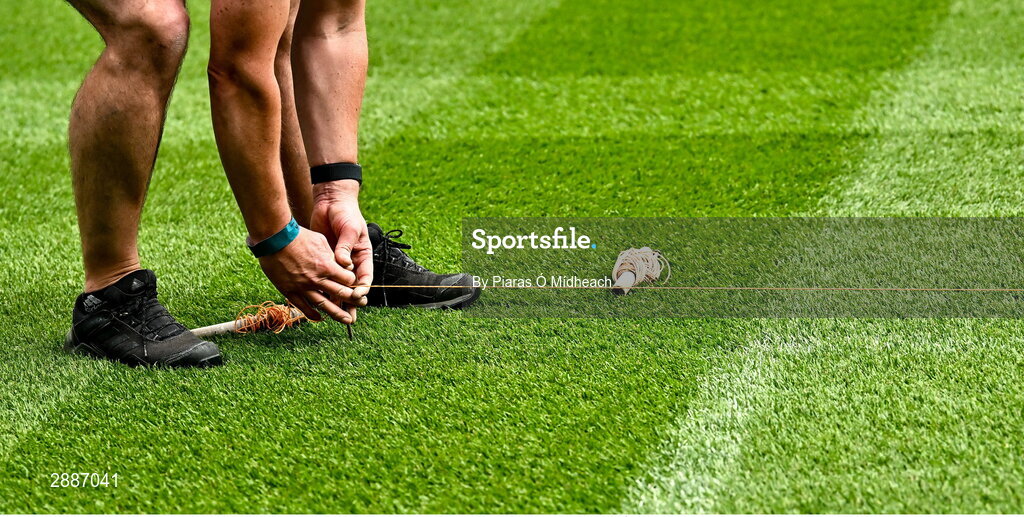 21 July 2024; Croke Park pitch manager Stuart Wilson places string in place before pitch lines are painted before the GAA Hurling All-Ireland Senior Championship Final between Clare and Cork at Croke Park in Dublin. Photo by Piaras Ó Mídheach/Sportsfile