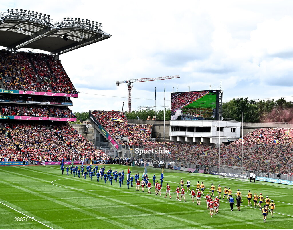 21 July 2024; Clare and Cork players march in the parade behind The Artane Band before the GAA Hurling All-Ireland Senior Championship Final between Clare and Cork at Croke Park in Dublin. Photo by Piaras Ó Mídheach/Sportsfile