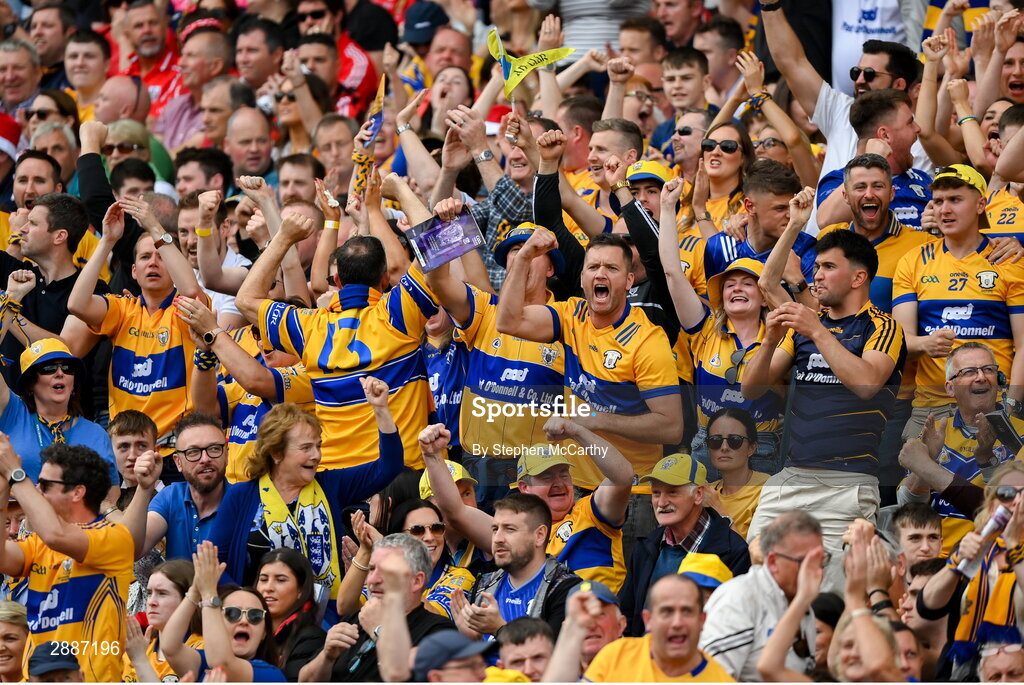 21 July 2024; Clare supporters celebrate a score during the GAA Hurling All-Ireland Senior Championship Final between Clare and Cork at Croke Park in Dublin. Photo by Stephen McCarthy/Sportsfile