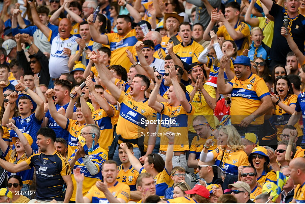 21 July 2024; Clare supporters celebrate a score during the GAA Hurling All-Ireland Senior Championship Final between Clare and Cork at Croke Park in Dublin. Photo by Stephen McCarthy/Sportsfile