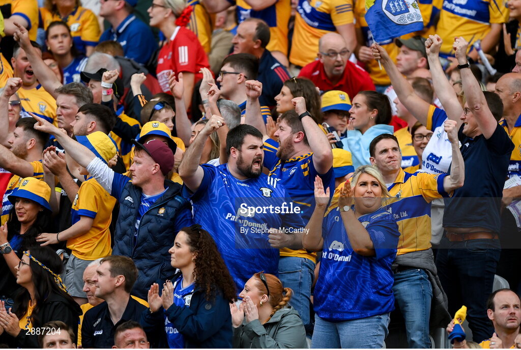 21 July 2024; Clare supporters celebrate a score during the GAA Hurling All-Ireland Senior Championship Final between Clare and Cork at Croke Park in Dublin. Photo by Stephen McCarthy/Sportsfile