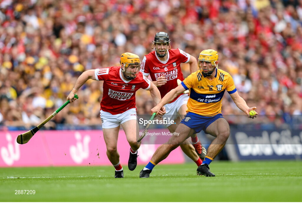 21 July 2024; Mark Rodgers of Clare in action against Robert Downey, centre, and Niall O'Leary, 2, of Cork during the GAA Hurling All-Ireland Senior Championship Final between Clare and Cork at Croke Park in Dublin. Photo by Stephen McCarthy/Sportsfile