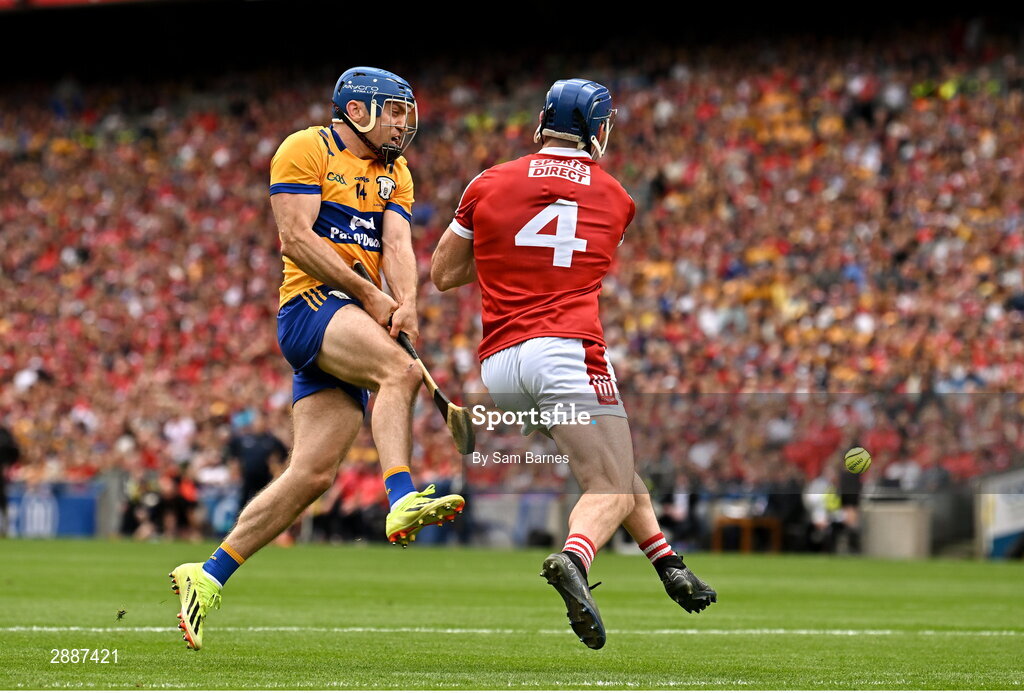 21 July 2024; Shane O'Donnell of Clare has a shot on goal under pressure from Seán O'Donoghue of Cork during the GAA Hurling All-Ireland Senior Championship Final between Clare and Cork at Croke Park in Dublin. Photo by Sam Barnes/Sportsfile