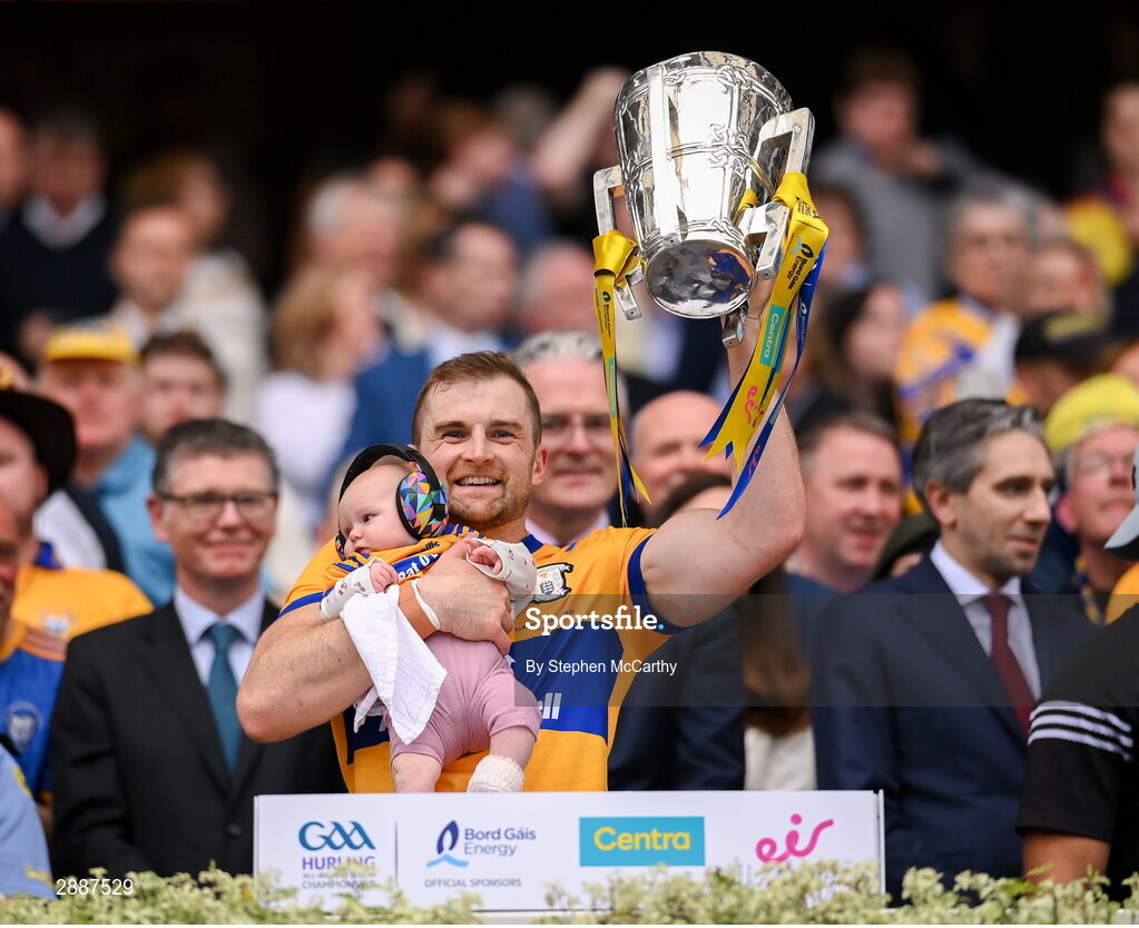 21 July 2024; Clare's Seadna Morey with his daughter Fiadhna lifts the Liam MacCarthy cup following victory in the GAA Hurling All-Ireland Senior Championship Final between Clare and Cork at Croke Park in Dublin. Photo by Stephen McCarthy/Sportsfile