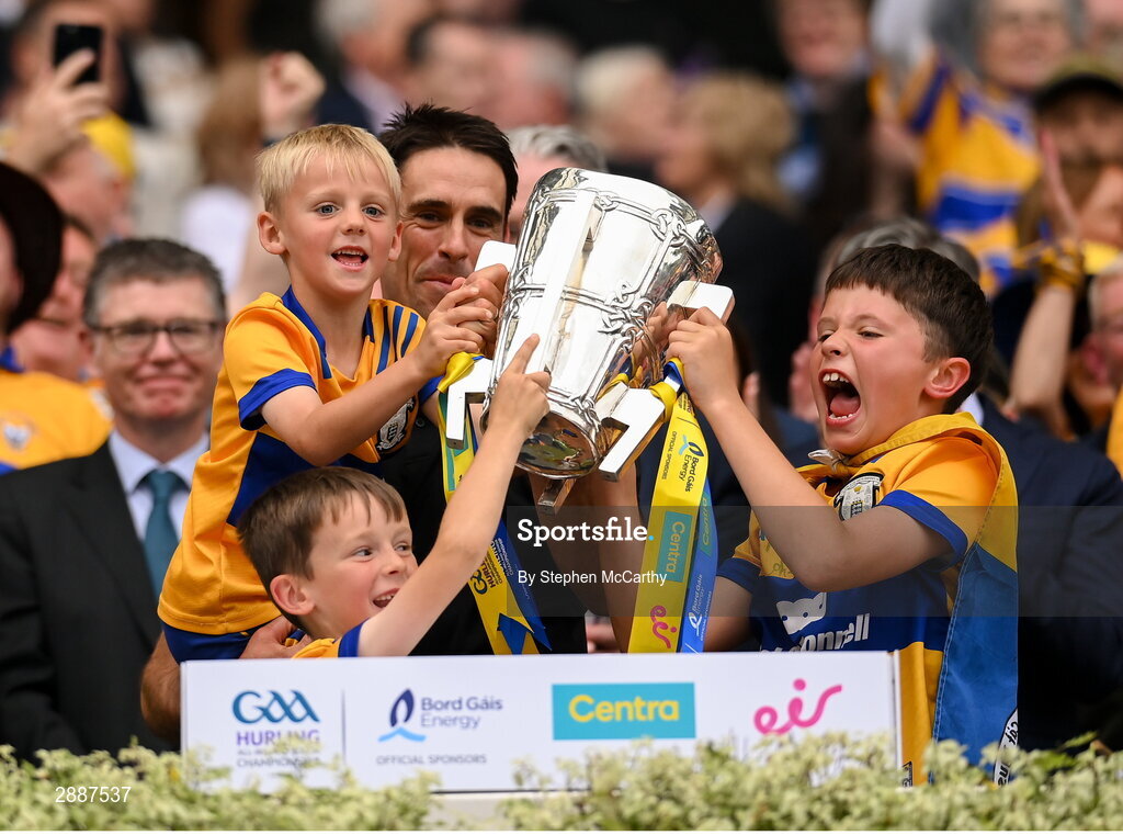 21 July 2024; Clare selector Brendan Bugler and family lift the Liam MacCarthy cup following victory in the GAA Hurling All-Ireland Senior Championship Final between Clare and Cork at Croke Park in Dublin. Photo by Stephen McCarthy/Sportsfile