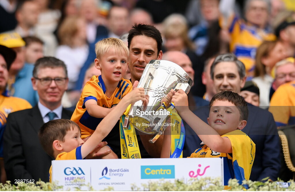 21 July 2024; Clare selector Brendan Bugler and family lift the Liam MacCarthy cup following victory in the GAA Hurling All-Ireland Senior Championship Final between Clare and Cork at Croke Park in Dublin. Photo by Stephen McCarthy/Sportsfile
