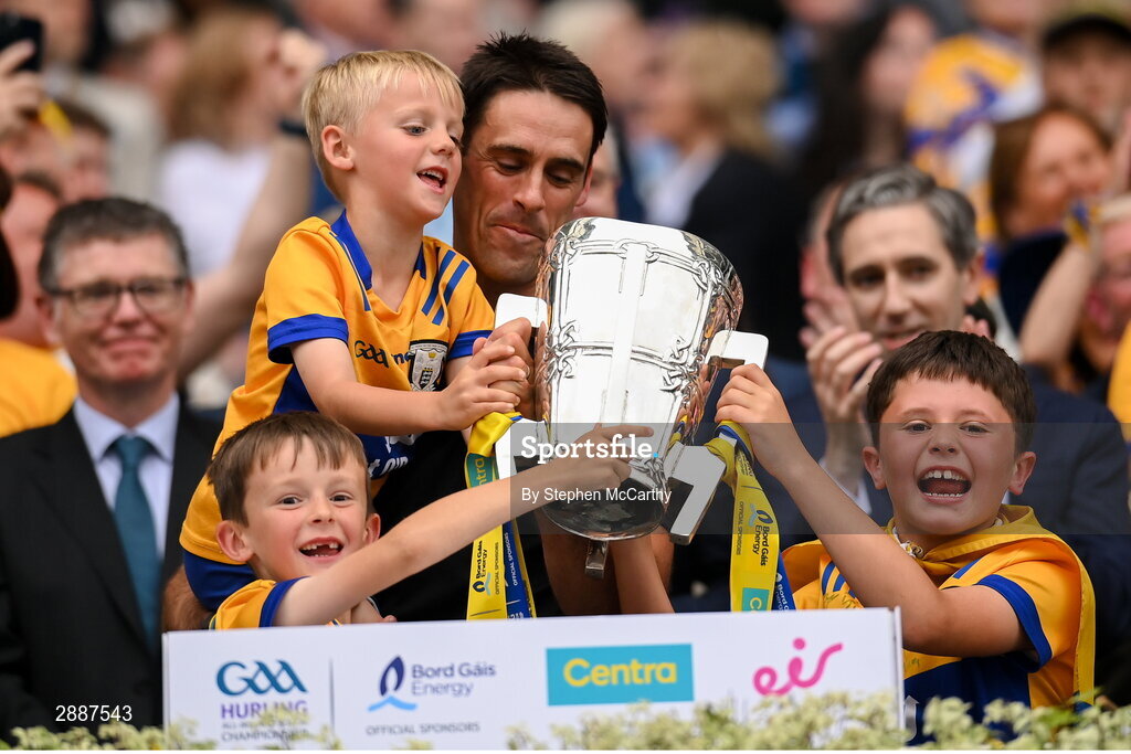 21 July 2024; Clare selector Brendan Bugler and family lift the Liam MacCarthy cup following victory in the GAA Hurling All-Ireland Senior Championship Final between Clare and Cork at Croke Park in Dublin. Photo by Stephen McCarthy/Sportsfile