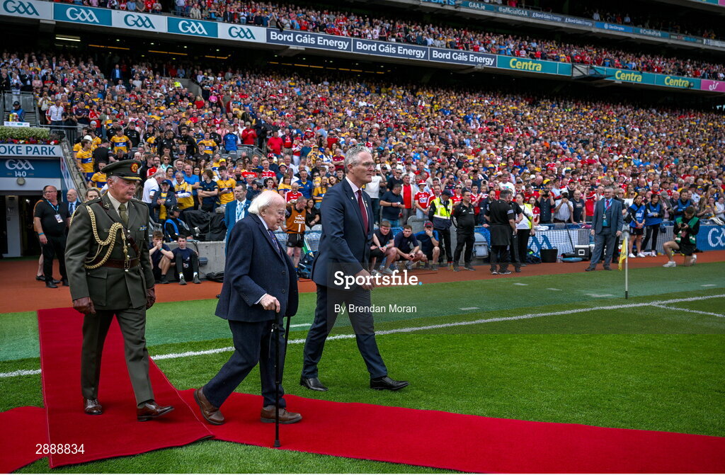 21 July 2024; President of Ireland Michael D Higgins and Uachtarán Chumann Lúthchleas Gael Jarlath Burns make their way to meet the teams before the GAA Hurling All-Ireland Senior Championship Final between Clare and Cork at Croke Park in Dublin. Photo by Brendan Moran/Sportsfile