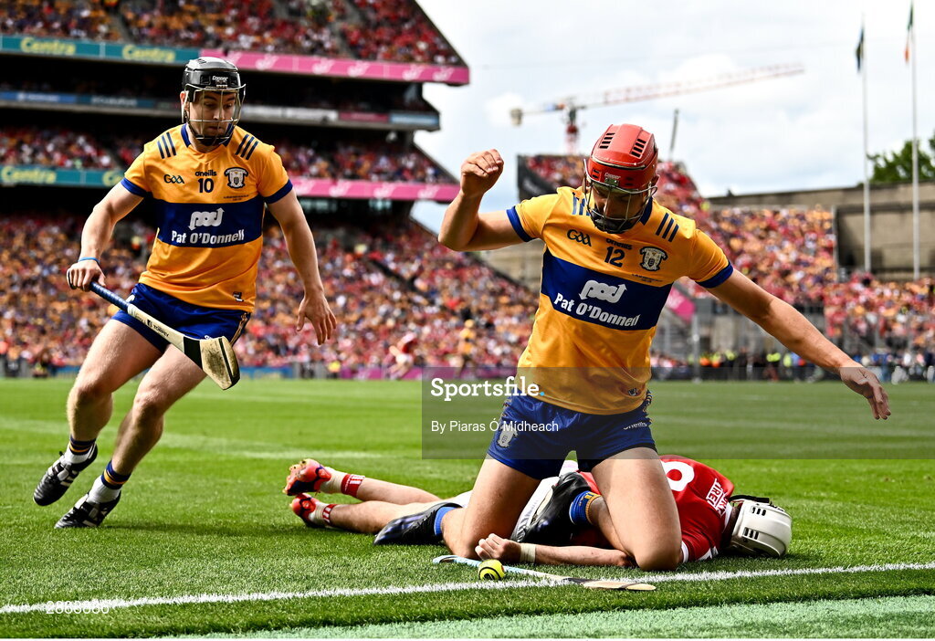 21 July 2024; Peter Duggan of Clare, 12, and team-mate Tony Kelly in action against Tim O'Mahony of Cork during the GAA Hurling All-Ireland Senior Championship Final between Clare and Cork at Croke Park in Dublin. Photo by Piaras Ó Mídheach/Sportsfile