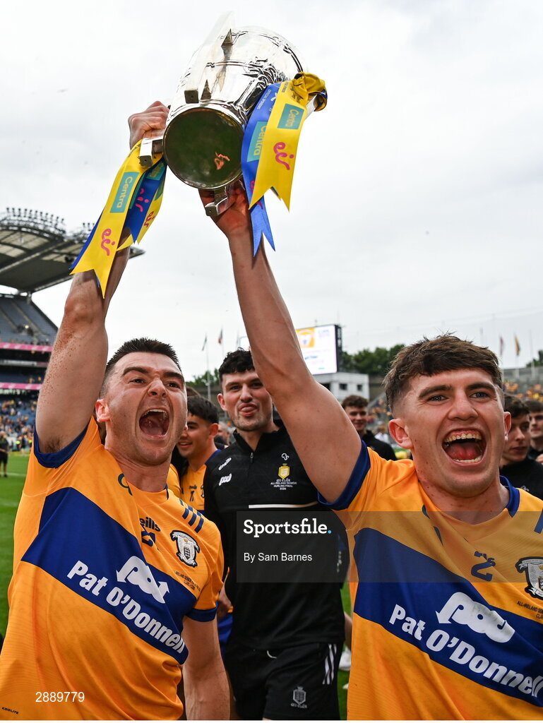 21 July 2024; Clare players including Ryan Taylor, centre, and Adam Hogan, right, celebrate with the Liam MacCarthy cup after his side's victory in the GAA Hurling All-Ireland Senior Championship Final between Clare and Cork at Croke Park in Dublin. Photo by Sam Barnes/Sportsfile