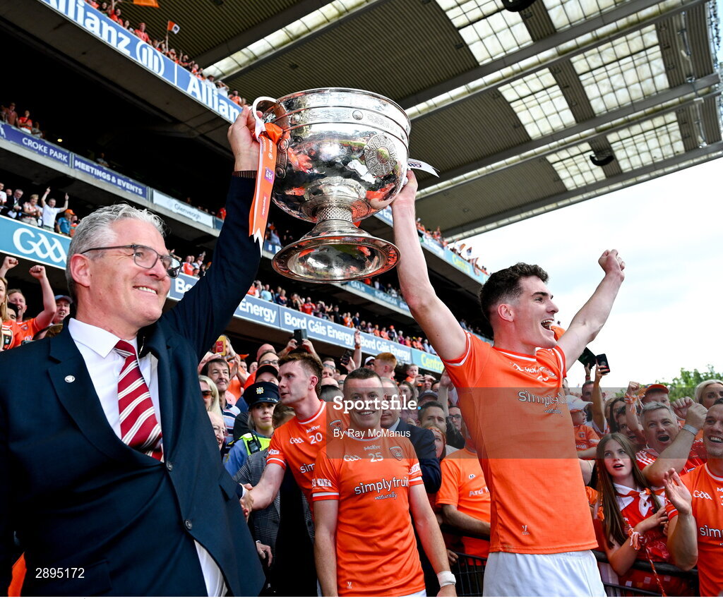 28 July 2024; Jarly Óg Burns of Armagh and his dad the Uachtarán Chumann Lúthchleas Gael Jarlath Burns lift the Sam Maguire Cup after the GAA Football All-Ireland Senior Championship Final match between Armagh and Galway at Croke Park in Dublin. Photo by Ray McManus/Sportsfile