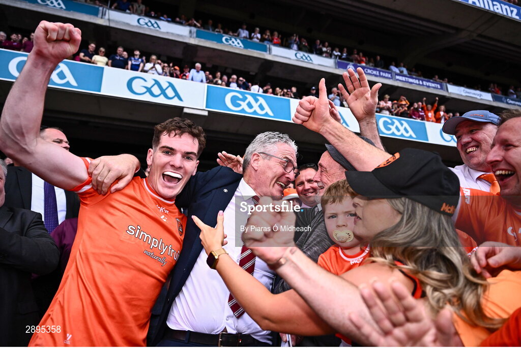 28 July 2024; Jarly Óg Burns of Armagh celebrates with his father, Uachtarán Chumann Lúthchleas Gael Jarlath Burns, after victory in the GAA Football All-Ireland Senior Championship Final match between Armagh and Galway at Croke Park in Dublin. Photo by Piaras Ó Mídheach/Sportsfile