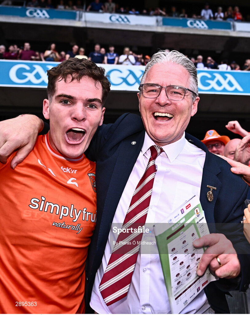 28 July 2024; Jarly Óg Burns of Armagh celebrates with his father, Uachtarán Chumann Lúthchleas Gael Jarlath Burns, after victory in the GAA Football All-Ireland Senior Championship Final match between Armagh and Galway at Croke Park in Dublin. Photo by Piaras Ó Mídheach/Sportsfile