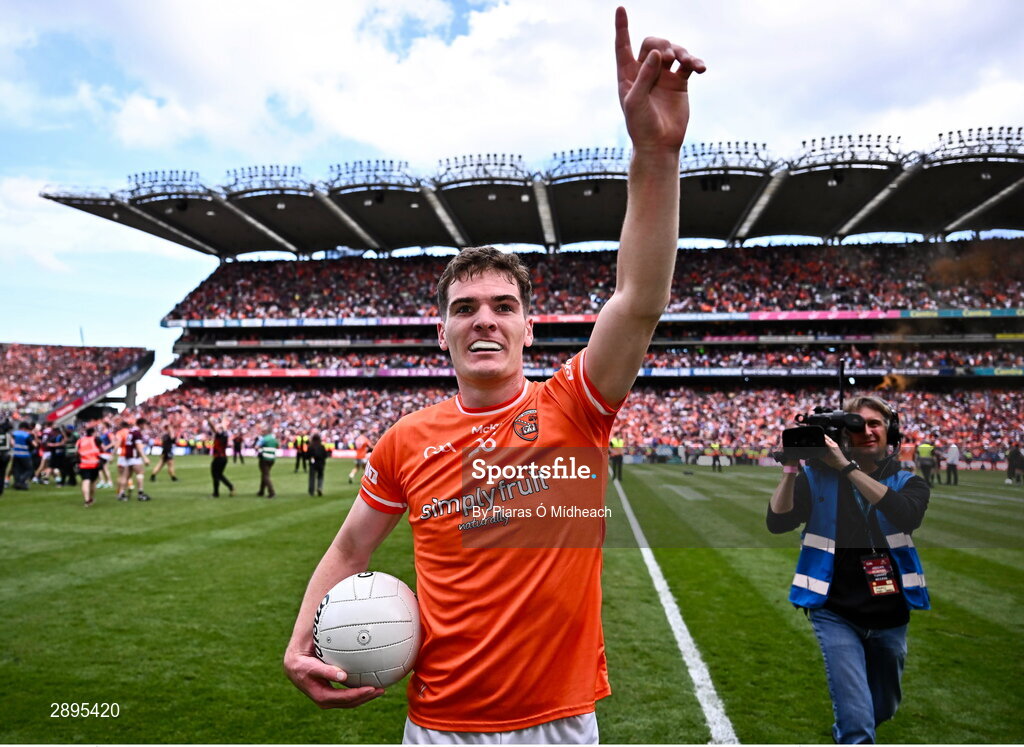 28 July 2024; Jarly Óg Burns of Armagh waves his to father, Uachtarán Chumann Lúthchleas Gael Jarlath Burns, and his mother Suzanne in the Hogan Stand after his side's victory in the GAA Football All-Ireland Senior Championship Final match between Armagh and Galway at Croke Park in Dublin. Photo by Piaras Ó Mídheach/Sportsfile