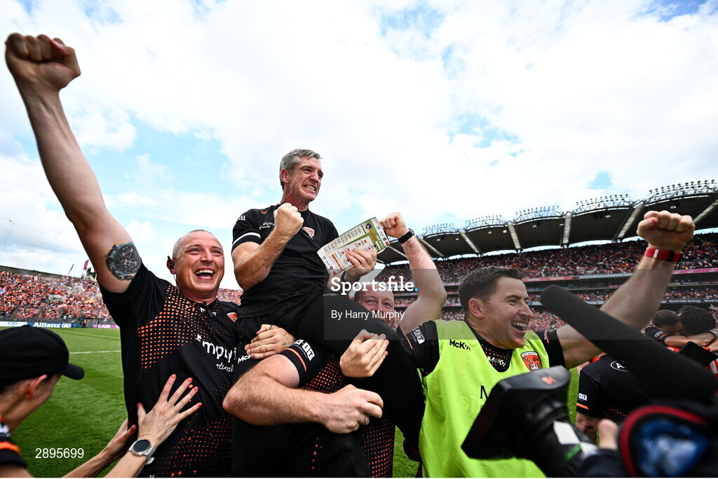 28 July 2024; Armagh manager Kieran McGeeney is lifted by his selectors Kieran Donaghy, Ciarán McKeever and Conleth Gilligan after their side's victory in the GAA Football All-Ireland Senior Championship Final match between Armagh and Galway at Croke Park in Dublin. Photo by Harry Murphy/Sportsfile