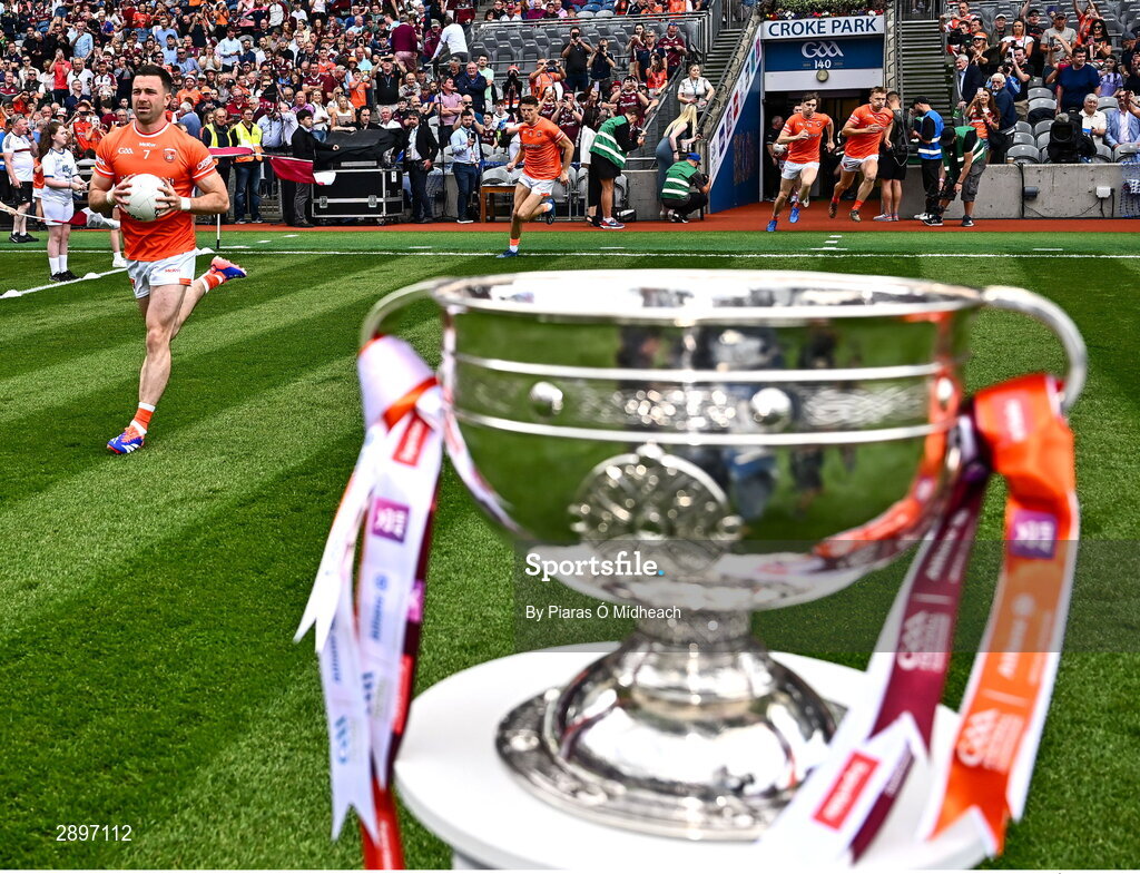 28 July 2024; Armagh captain Aidan Forker, left, makes his way onto the pitch, past the Sam Maguire Cup, before the GAA Football All-Ireland Senior Championship Final match between Armagh and Galway at Croke Park in Dublin. Photo by Piaras Ó Mídheach/Sportsfile