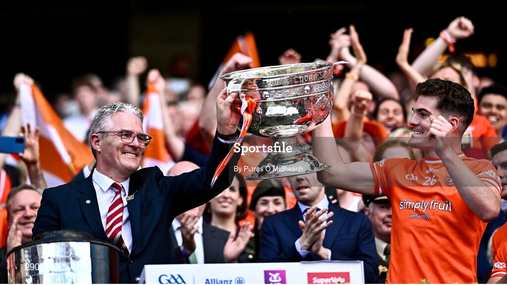 28 July 2024; Jarly Óg Burns of Armagh lifts the Sam Maguire Cup with his father Uachtarán Chumann Lúthchleas Gael Jarlath Burns after the GAA Football All-Ireland Senior Championship Final match between Armagh and Galway at Croke Park in Dublin. Photo by Piaras Ó Mídheach/Sportsfile