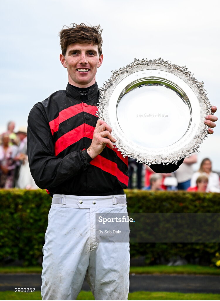 31 July 2024; Jockey Donagh Meyler celebrates with the trophy after winning the Tote Galway Plate on Pinkerton during day three of the Galway Races Summer Festival at Ballybrit Racecourse in Galway. Photo by Seb Daly/Sportsfile