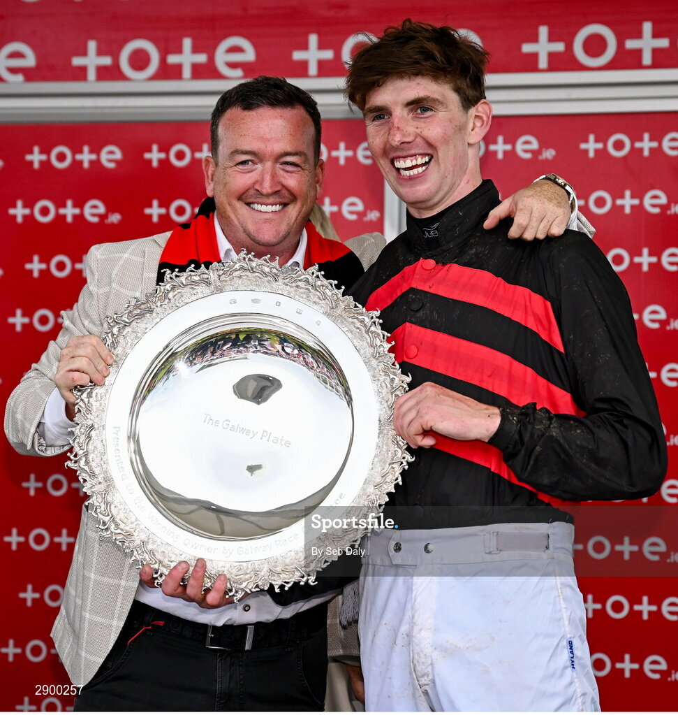 31 July 2024; Owner Philip Polly, left, and jockey Donagh Meyler celebrate with the trophy after sending out Pinkerton to win the Tote Galway Plate during day three of the Galway Races Summer Festival at Ballybrit Racecourse in Galway. Photo by Seb Daly/Sportsfile