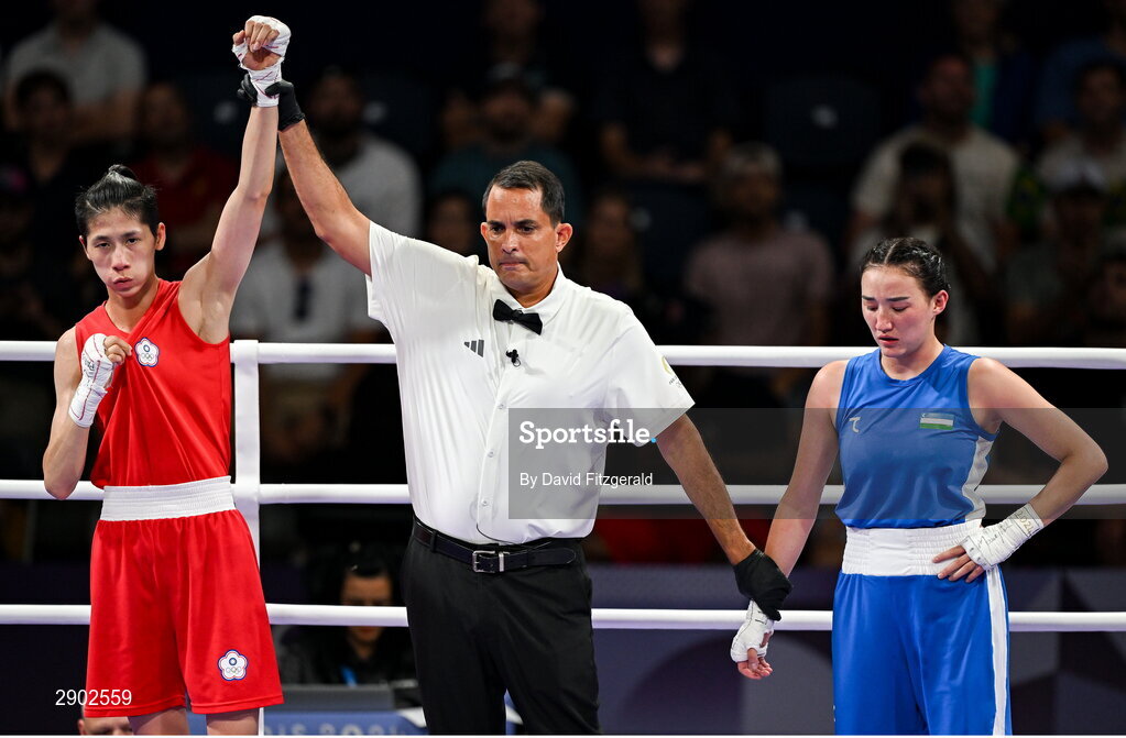 2 August 2024; Yu Ting Lin of Team Chinese Taipei, left, is awarded the win over Sitora Turdibekova of Team Uzbekistan by referee Emmanuel Ferreira in their women's 57kg preliminary round of 16 bout at the North Paris Arena during the 2024 Paris Summer Olympic Games in Paris, France. Photo by David Fitzgerald/Sportsfile
