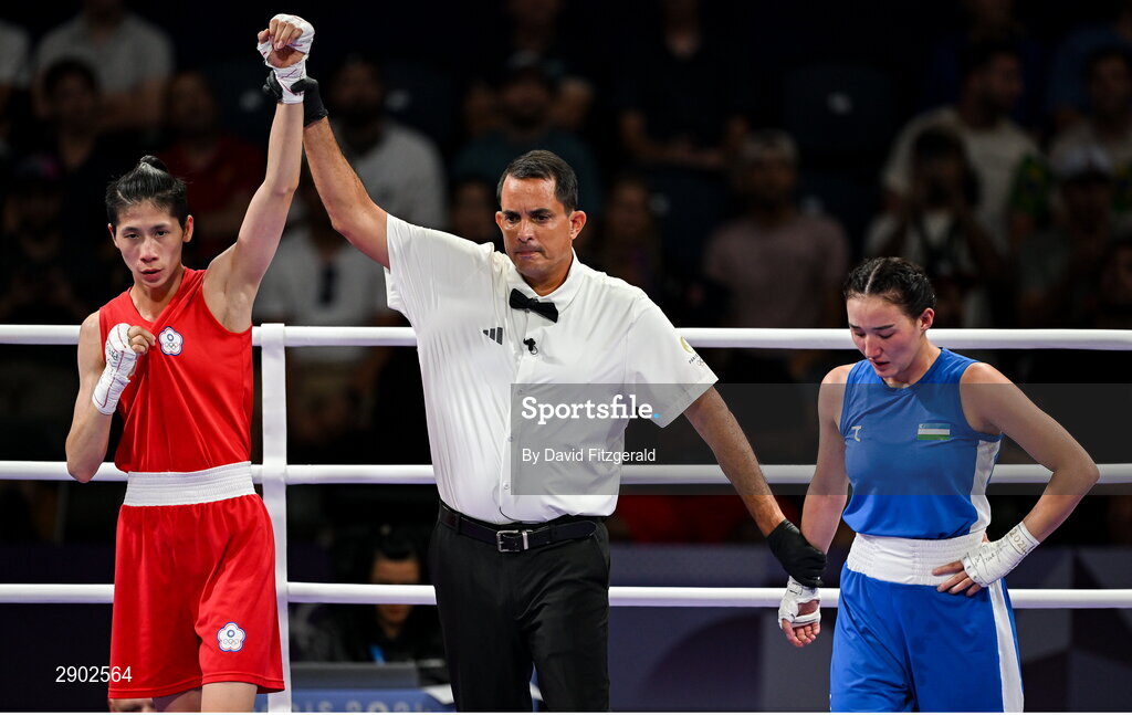 2 August 2024; Yu Ting Lin of Team Chinese Taipei, left, is awarded the win over Sitora Turdibekova of Team Uzbekistan by referee Emmanuel Ferreira in their women's 57kg preliminary round of 16 bout at the North Paris Arena during the 2024 Paris Summer Olympic Games in Paris, France. Photo by David Fitzgerald/Sportsfile