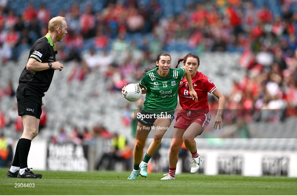 4 August 2024; Referee Ger Canny looks on as Bláithín Bogue of Fermanagh is tackled by Kate Flood of Louth during the TG4 All-Ireland Ladies Junior Football Championship final match between Fermanagh and Louth at Croke Park, Dublin. Photo by Ray McManus/Sportsfile