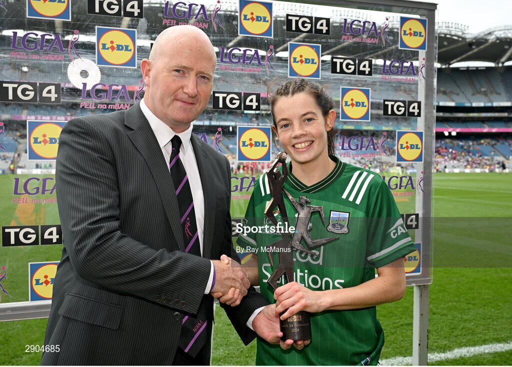 4 August 2024; Eimear Smyth of Fermanagh receives the Player of the Match award from Rónán Ó Coisdealbha, Head of Sport, TG4, following the TG4 All-Ireland Ladies Junior Football Championship Final between Fermanagh and Louth at Croke Park, Dublin.  Photo by Ray McManus/Sportsfile