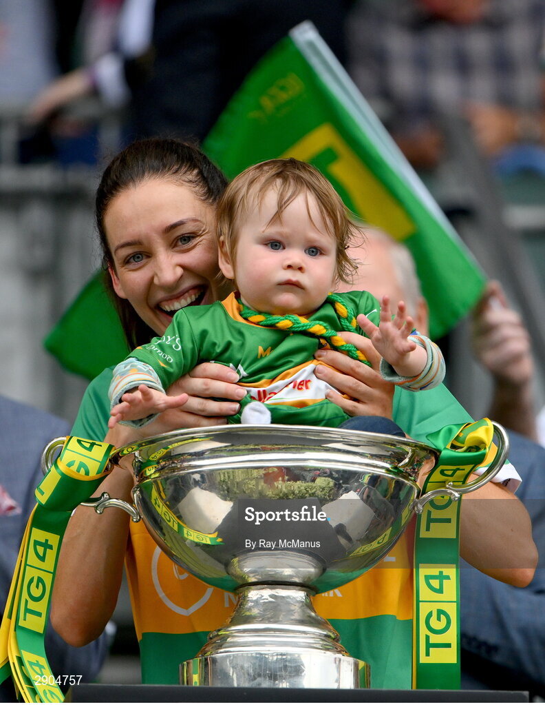 4 August 2024; Orla Flynn of Leitrim with her son Noah, aged 1, and the Mary Quinn Memorial cup after TG4 All-Ireland Ladies Football Intermediate Championship final match between Leitrim and Tyrone at Croke Park, Dublin. Photo by Ray McManus/Sportsfile