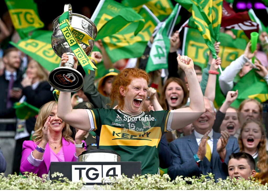 4 August 2024; Louise Ní Mhuircheartaigh of Kerry lifts the the Brendan Martin cup after her side's victory in the TG4 All-Ireland Ladies Football Senior Championship final match between Galway and Kerry at Croke Park, Dublin. Photo by Seb Daly/Sportsfile