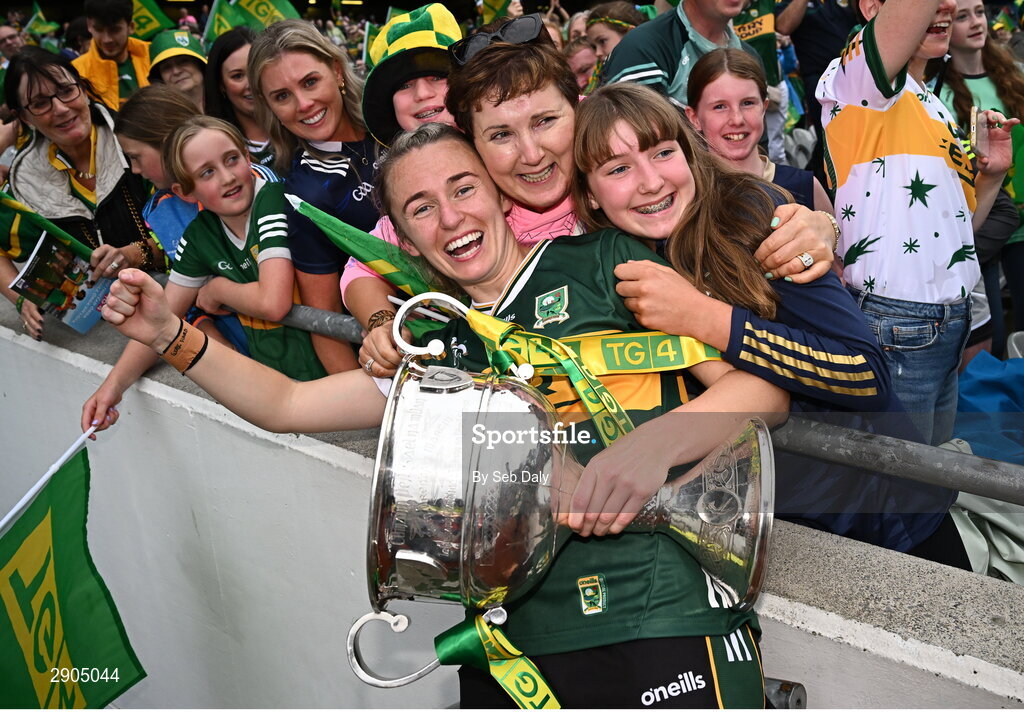 4 August 2024; Kerry captain Niamh Carmody celebrates with her aunt Eilís Lyons and cousin Sinead after her side's defeat in the TG4 All-Ireland Ladies Football Senior Championship final match between Galway and Kerry at Croke Park, Dublin. Photo by Seb Daly/Sportsfile