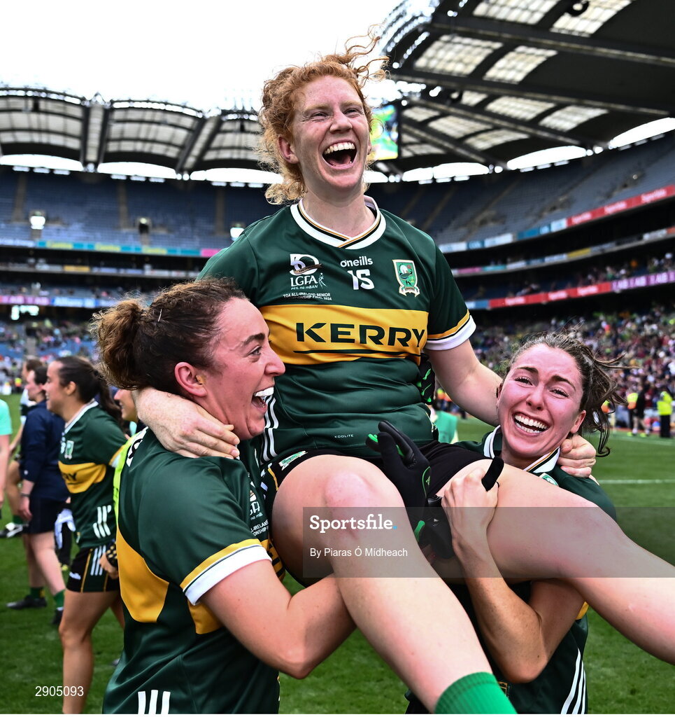 4 August 2024; Louise Ní Mhuircheartaigh of Kerry is held aloft by team-mates Aishling O'Connell and Eilís Lynch, right, after their side's victory in the TG4 All-Ireland Ladies Football Senior Championship final match between Galway and Kerry at Croke Park in Dublin. Photo by Piaras Ó Mídheach/Sportsfile
