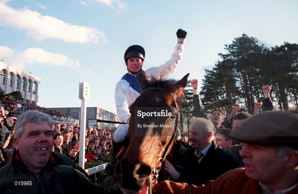 2 February 1997; Tommy Treacy celebrates on Danoli after winning The Champion Hurdle during Horse Racing from Leopardstown in Dublin. Photo by Brendan Moran/Sportsfile