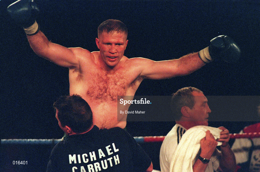 19 September 1998; Michael Carruth celebrates with coach Steve Collins after winning his WAA Welterweight Championship bout against Scott Dixon at the National Basketball Arena in Tallaght, Dublin. Photo by David Maher/Sportsfile