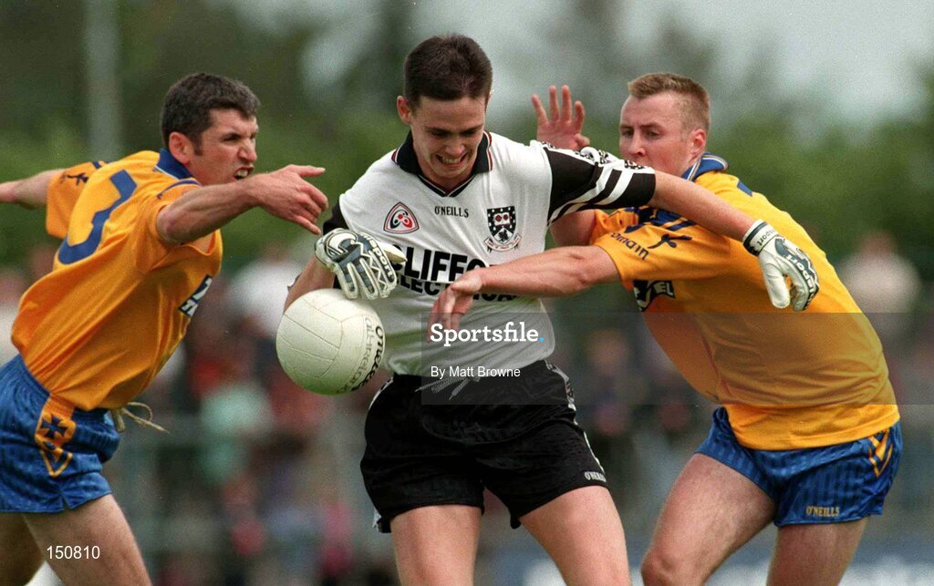 28 June 1998; David Durkin, Sligo is tackled by Damien Donlon, left, and  Michael Ryan, Roscommon. Sligo v Roscommon, Connacht Football Championship, Dr. Hyde Park, Roscommon Town, Co. Roscommon. Football. Picture credit; Matt Browne / SPORTSFILE